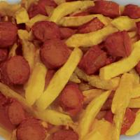 Salchipapas · French fries with fried hot dogs.