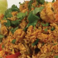 Arroz Con Mariscos · Rice cooked in hot sauce with seafood.