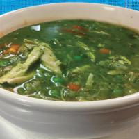 Aguadito De Pollo · Chicken soup with cilantro sauce and rice.