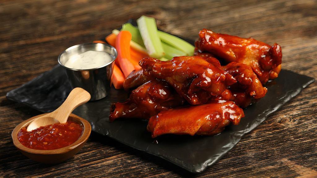 Sweet Chili · 8 sweet chili wings (mild heat), served with carrots & celery and a choice of blue cheese, classic ranch, or Sriracha ranch for dipping