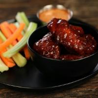 Boneless Teriyaki · 8 boneless wings tossed in teriyaki, served with carrots & celery and a dipping sauce of you...