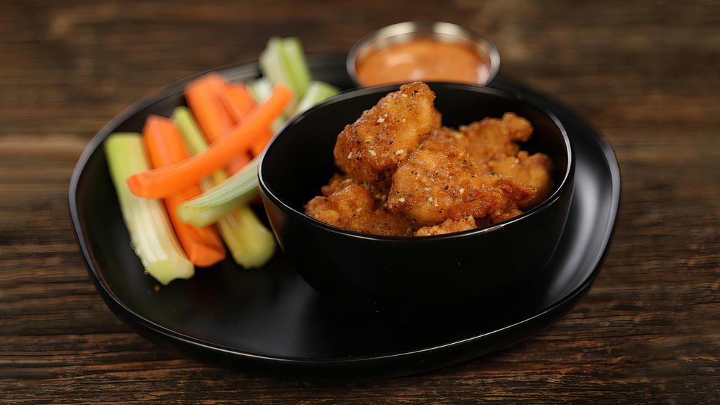 Boneless Lemon Pepper · 8 boneless wings tossed in lemon pepper (mild heat), served with carrots & celery and a dipping sauce of your choice