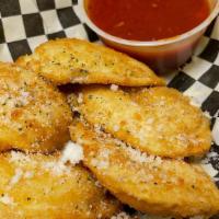 Fried Ravioli · 6 Pieces. Savory filling wrapped in square ravioli, breaded and deep-fried until the pasta s...