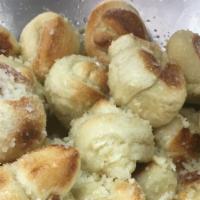 Homemade Garlic Knots · Bread, topped with garlic & olive oil or butter, herb seasoning, baked to perfection. Melts ...