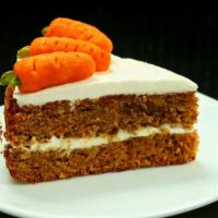 Carrot Cake · Freshly baked spice and carrot cake covered in creamy cream cheese icing.