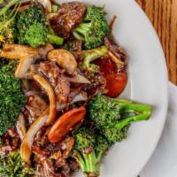 Beef With Broccoli · Beef sautéed with broccoli, white onions, and carrots in a light garlic sauce