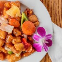 Sweet And Sour Chicken · Battered chicken covered with sweet and sour sauce, pineapple, carrots, bell pepper and whit...