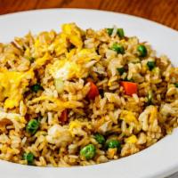 Egg Fried Rice · Authentic fried rice cooked with eggs, peas and carrots, and green onions