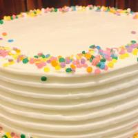 Confetti Birthday - Slice · Light sponge cake dotted with colored sprinkles, vanilla syrup, vanilla butter cream frostin...