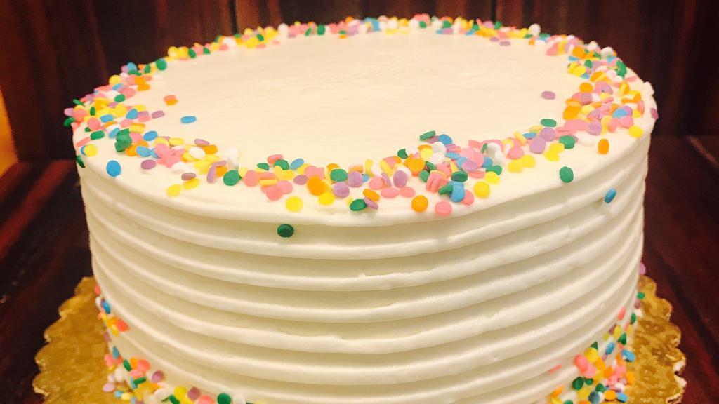Confetti Birthday - Slice · Light sponge cake dotted with colored sprinkles, vanilla syrup, vanilla butter cream frosting, more sprinkles.