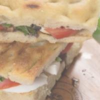 Caprese Sandwich · Mozzarella, roasted tomato, basil, balsamic vinegar on focaccia.