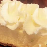 Cheesecake Bite · Vanilla cheesecake, graham cracker crust, topped with whipped cream.
