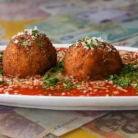 Arancini · Classic italian street food. Saffron infused risotto balls stuffed with fontina cheese - bre...