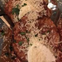 Eggplant Parmigiana Spectacular · Vegetarian. Thin disks of eggplant encrusted with parmesan and fried crispy and golden, then...