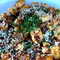Lamb Gnocchi                                                                                                             · House made potato dumplings tossed in a in a red wine and figs sloooow braised Lamb Shank Ra...