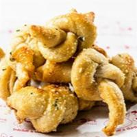 Garlic Knots · Served with a side of tomato sauce