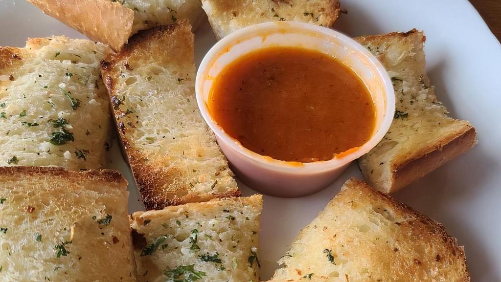 Garlic Bread · Italian bread rubbed with garlic butter and baked, served with side of house made marinara sauce.