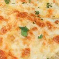 Garlic Cheese Bread · Italian bread rubbed with garlic butter then topped with mozzarella cheese and baked. Served...
