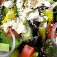 Greek Salad · Fresh crisp romaine lettuce, kalamata olives, tomato, cucumber, red onion, feta cheese and d...