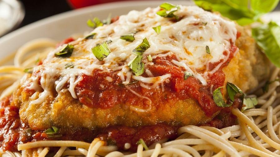 Chicken Parmesan · Chicken breast lightly breaded, topped with house made marinara sauce and mozzarella cheese, served with penne and marinara sauce.
