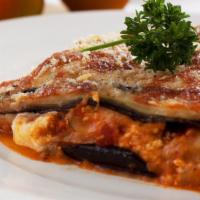 Eggplant Parmesan · Lightly egg battered eggplant, layered with house made marinara sauce and mozzarella cheese,...