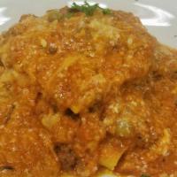 Lasagna Bolognese · Layers of pasta, mozzarella cheese, house bechamel sauce and our house made red meat sauce.