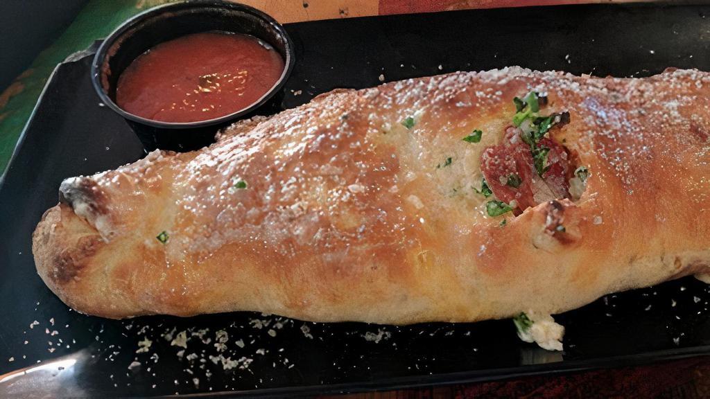 Porcellina Calzone (Meat Lovers) · Meat lovers. Mozzarella cheese, canadian bacon, pepperoni, house made sausage, meatball, salami, capicola and bacon. Served with side of house made marinara sauce.