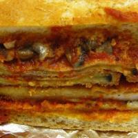 Eggplant Parmesan Sandwich · Italian bread, lightly breaded slices of eggplant, house made marinara, mozzarella cheese.