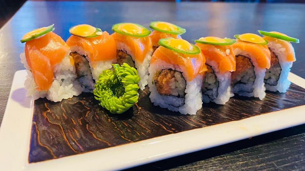 Mexican Roll · Spicy yellowtail , cucumber inside, topped with salmon, jalapeno and spicy mayo