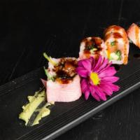 Pink Roll · White Tuna, salmon, seaweed salad, tempura eel and avocado wrapped with pink soy paper, eel ...