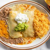 Enchiladas Rancheras · Two Corn Tortillas stuffed with Chicken or Shredded Beef covered with Sauce and Cheese, serv...