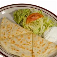 Quesadilla · Flour Tortilla stuffed with Jack Cheese, (Chicken or Shredded Beef), side of Lettuce, Guacam...