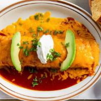 Enchilada Grande · Flour Tortilla stuffed with Chicken or Shredded Beef covered with Enchilada Sauce and Cheese...