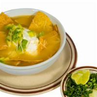 Tortilla Soup · Tortilla Chips in a Chicken Soup, garnished with Cheese, side of Avocados and Sour Cream.