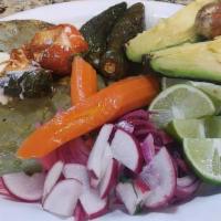 Mexican Plates · 3 grilled cactus leaves, three jalapeños filled with melted cheese, full avocado, lime wedge...