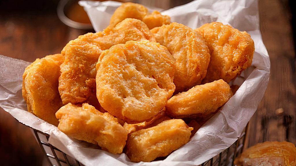 Kids Chicken Nuggets · Five chicken nuggets, rice and beans or French fries.