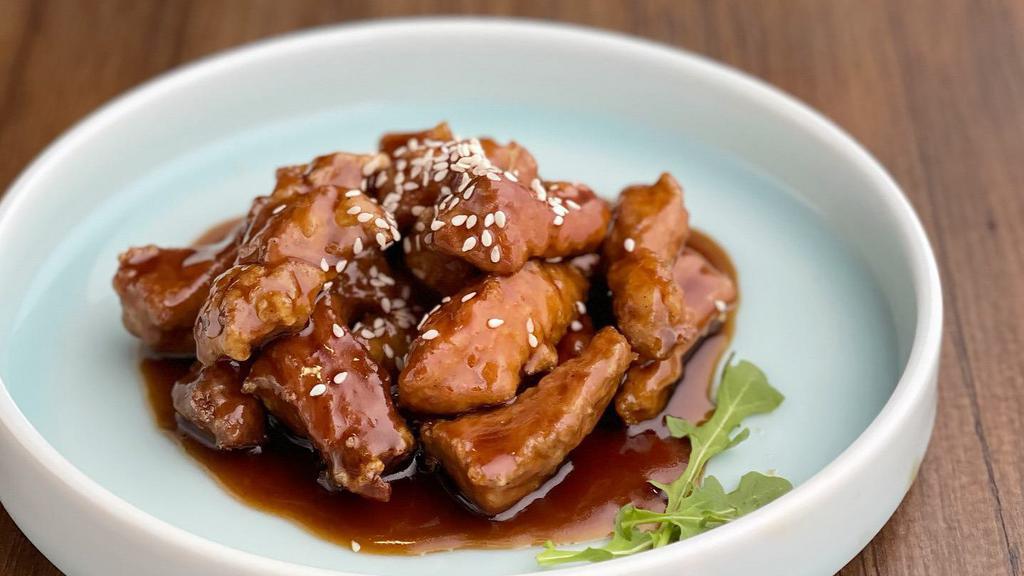 Sweet & Sour Pork Tenderloin · 糖醋里脊 - Juicy pork tenderloin in sweet and sour sauce, sprinkled with roasted sesame.