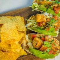 Grilled Fish Tacos · Mahi mahi, chipotle aioli, avocado, and sweet cabbage. Served with warm chips and arbol sals...