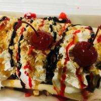 Banana Split
 · 3 ice cream scoops, chocolate syrup, caramel syrup, strawberry syrup, and whip cream.