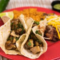 Chicken Tacos (2) · Grilled chicken, lettuce, tomato, pico de gallo & salsa served with Mexican rice & pinto bea...