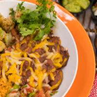 Sautéed Shrimp Burrito Bowl · Sautéed rock shrimp, rice, beans, pico de gallo & salsa served with Mexican rice & pinto bea...