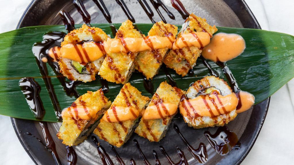 Ichi Roll · Deep-fried | Salmon, avocado, cream cheese topped with spicy mayo and eel sauce