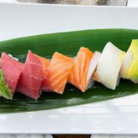 Rainbow Roll · Crab meat, cucumber and avocado topped with assorted fish