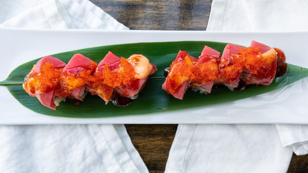 Firehouse Roll · Spicy tuna, cucumber and tempura crunch topped with tuna, tobiko, spicy mayo and hot chili sauce