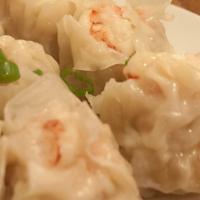 Shumai Steamed Dumplings · Chinese shumai dumplings with shrimp inside and a vegetable blend in steamed wontons, served...
