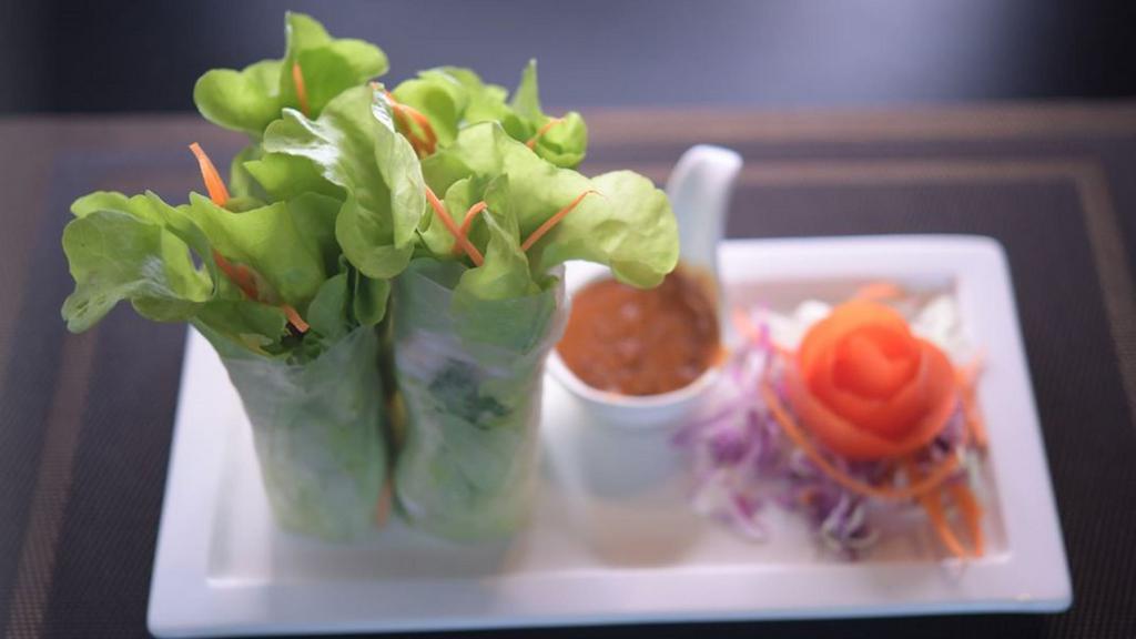 Prawn Fresh Rolls · Two delicious fresh rice paper rolls cut in half to make 4 pieces. Contains shrimp, fresh Thai basil, mint, cilantro, carrots, lettuce, and vermicelli noodles. Served with our delicious homemade peanut sauce.