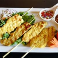 Chicken Satay (4 Skewers) · Strips of chicken marinated in special Thai seasoning and coconut cream sauce, then skewered...