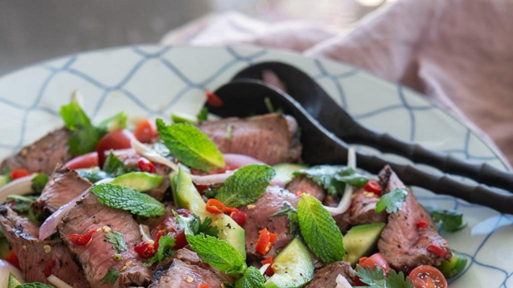 Beef Salad · Tender slices of grilled beef tossed in tomatoes, red onions, green onions, mint, cilantro, cucumber, lettuce and aromatic fresh chili. Serve with green vegetables.