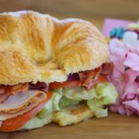 Supreme Lunch Sandwich · Boar's Head® Premium Deli Bacon, Ham & Turkey Gigantic Sandwich served with Cheese, Lettuce,...