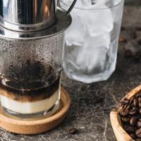Vietnamese Iced Coffee · Dangerously addictive strong drip coffee to power you up! Contains Dairy.